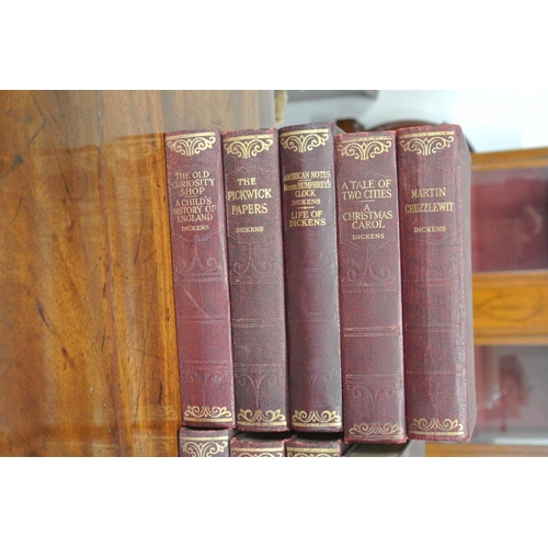 202 - A set of 14 antique Charles Dickens books.