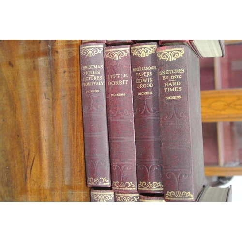 202 - A set of 14 antique Charles Dickens books.