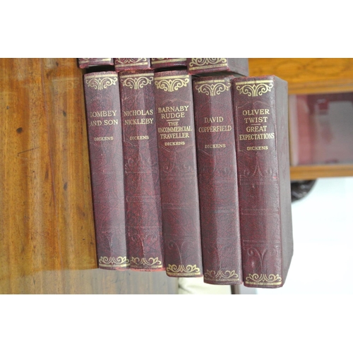 202 - A set of 14 antique Charles Dickens books.