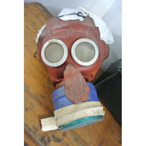 227 - An antique WW2 era Mickey Mouse gas mask, complete with original card box.