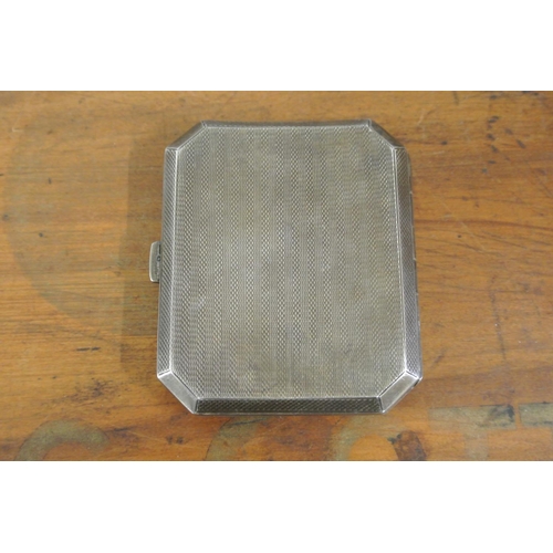 257 - An antique decorative sterling silver cigarette case with engine turned design, fully hallmarked to ... 