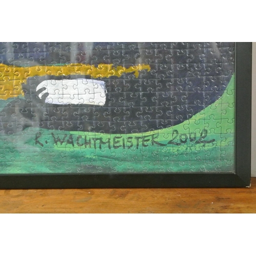 277 - A large framed jigsaw of cats, signed R. Wachtmeister 2002.