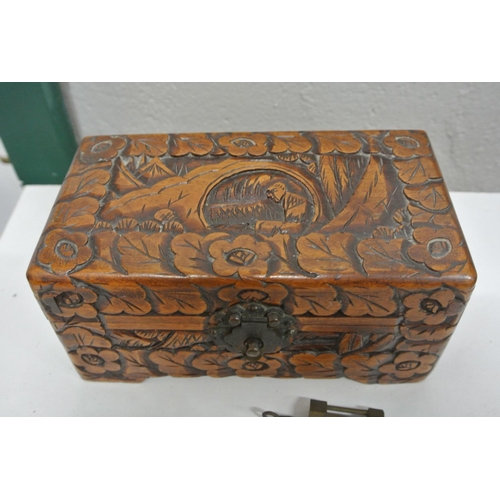 303 - A decorative wooden jewellery box with brass padlock.