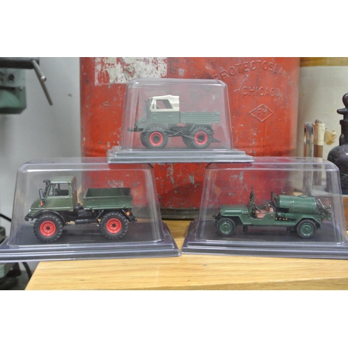 371 - A collection of 3 model cars in original packaging.