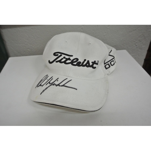 398 - A baseball cap signed by golfer Phil Mickelson in black marker pen.