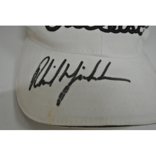 398 - A baseball cap signed by golfer Phil Mickelson in black marker pen.