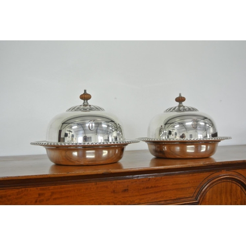 405 - A pair of antique silver plated cloches.