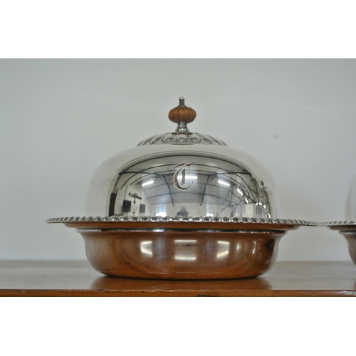 405 - A pair of antique silver plated cloches.