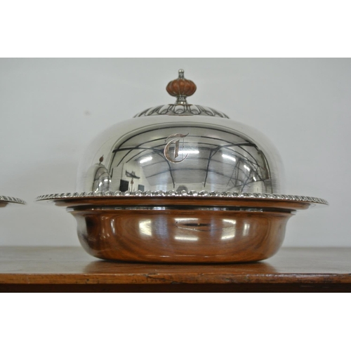 405 - A pair of antique silver plated cloches.