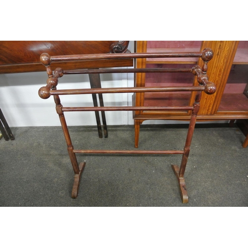 406 - An antique wooden towel rail.