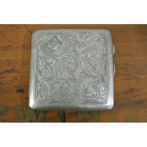 417 - An antique sterling silver cigarette with case with decorative engraved design & gilt interior.