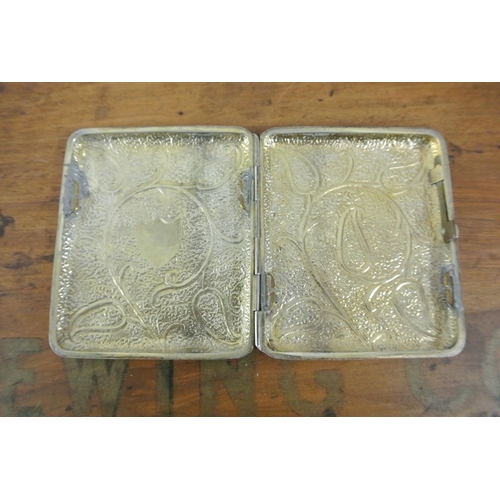 426 - An antique white metal cigarette with case with highly decorative design & gilt interior.