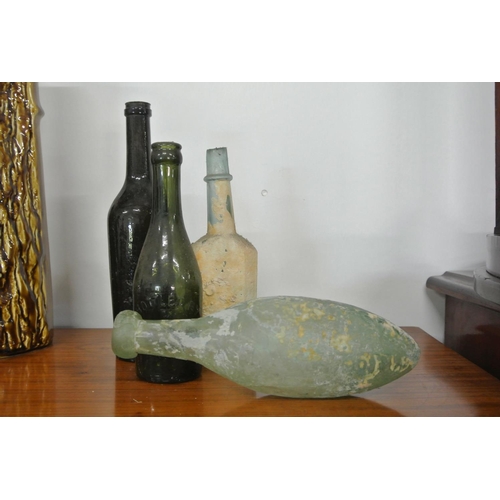 432 - A collection of 4 antique glass bottles.