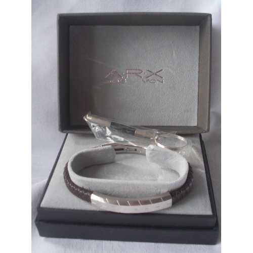 439 - AN ARX Jos Von fashion bracelet, white metal and braided leather with original box and accessories.