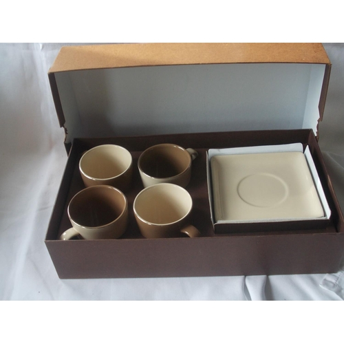 447 - A stylish Silea coffee set comprising four cups and saucers, in original box.