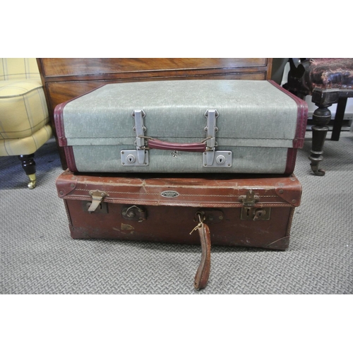 103 - A vintage brown suitcase.