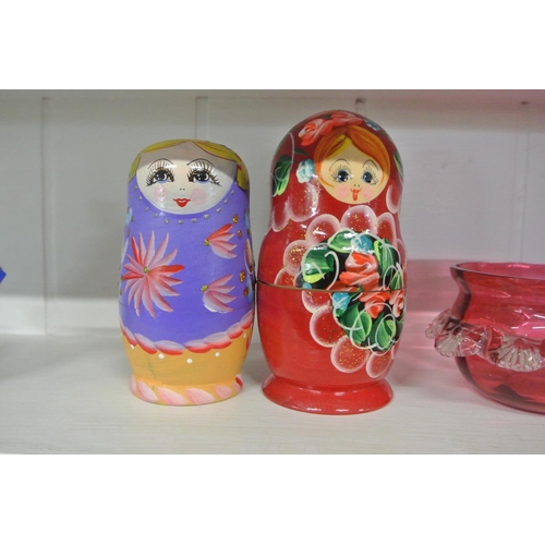 119 - 2 sets of wooden Russian Dolls.