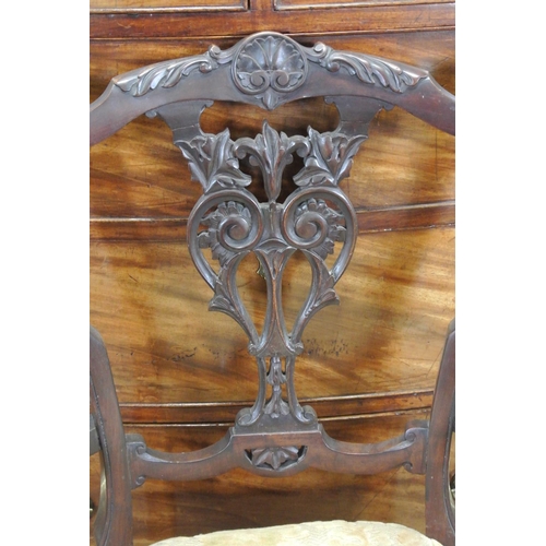 130 - An antique bedroom chair with decorative carved splat.