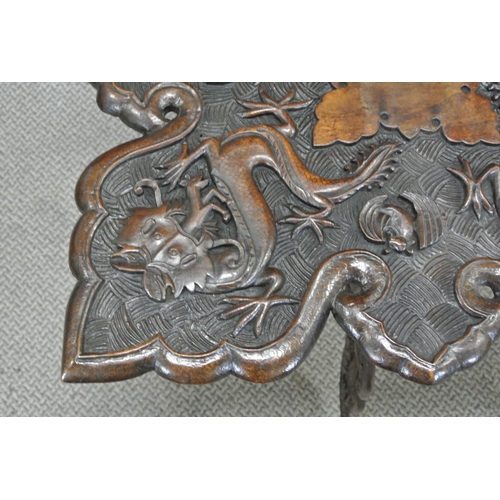 136 - A stunning antique hand carved Oriental/ Chinese table with dragon design.