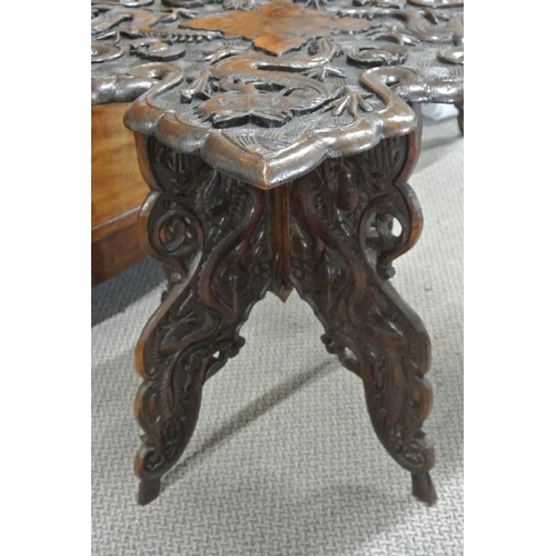 136 - A stunning antique hand carved Oriental/ Chinese table with dragon design.