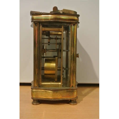 71 - A stunning antique brass serpentine cased carriage clock, dial reading 'Sharman D Neill - Belfast & ... 