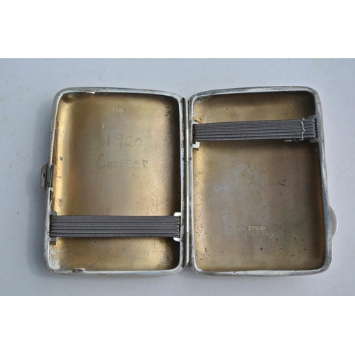 79 - An antique sterling silver cigarette case with gilt interior, produced by E J Trevitt & Sons, fully ... 