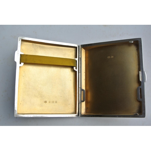 81 - An antique sterling silver cigarette case with gilt interior, produced by W J Myatt & Co, fully hall... 