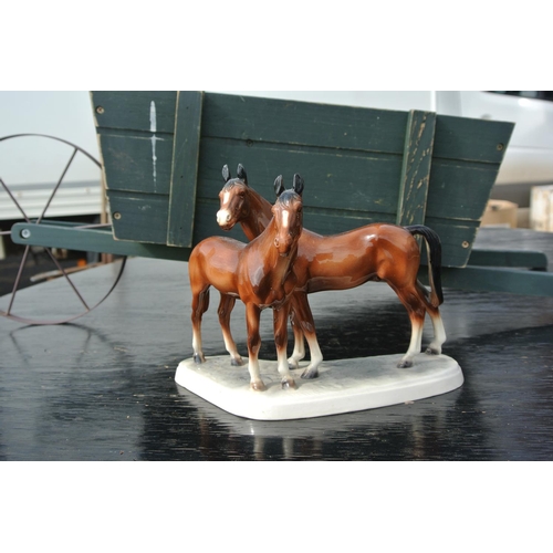 88 - A vintage ceramic Hertwig figure of horses.