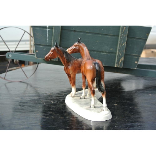 88 - A vintage ceramic Hertwig figure of horses.