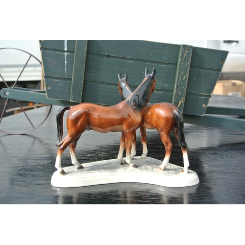 88 - A vintage ceramic Hertwig figure of horses.