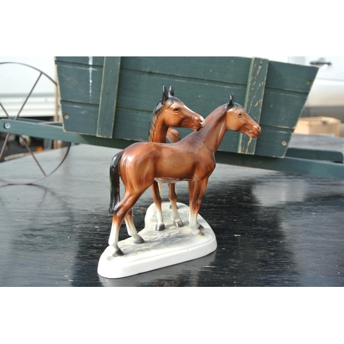 88 - A vintage ceramic Hertwig figure of horses.