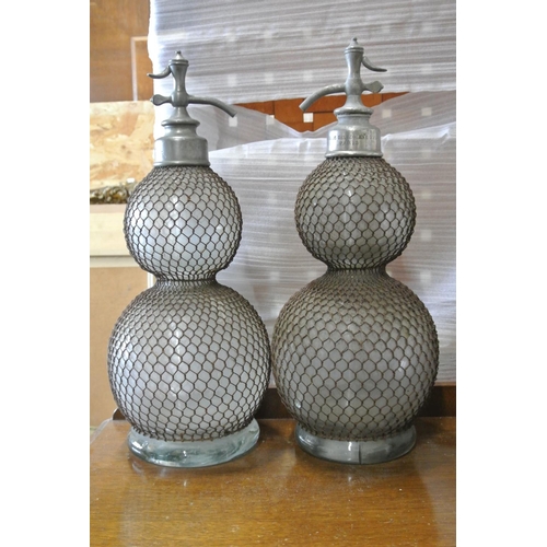 95 - A stunning & unusual pair of extra large antique French Hotel soda syphons with wire coverings (1 a/... 