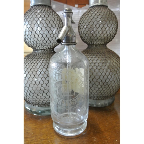 97 - A vintage/ antique glass soda syphon, for Grattan & Co - Belfast, with original paper label to rear.