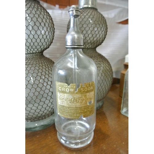 97 - A vintage/ antique glass soda syphon, for Grattan & Co - Belfast, with original paper label to rear.