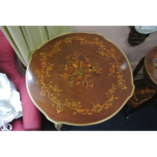 101 - An antique style occasional table with decorative brass design & inlaid top.