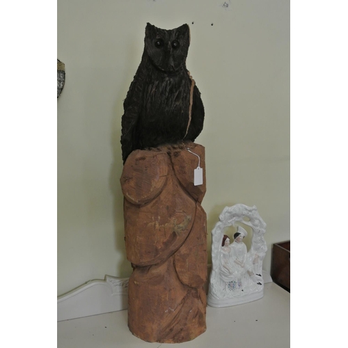 117 - A hand carved wooden owl on tree stump, made with a chainsaw from 1 solid piece of wood.