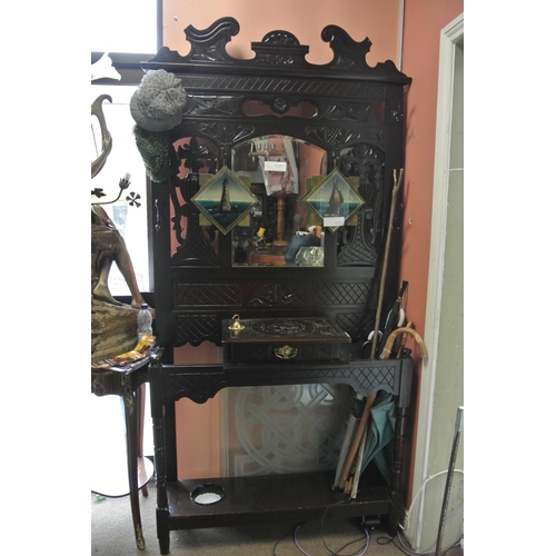 184 - An antique carved mirror back hallstand with drawer.