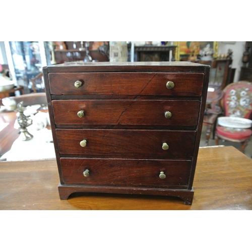 234 - A stunning antique apprentice chest of drawers with brass knobs  & inlaid top.