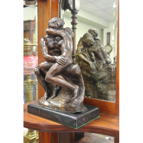 246 - A small bronze statue titled 'The Lovers Embrace' mounted on marble base.