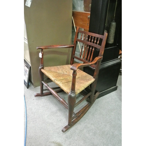 411 - A stunning antique Irish rocking chair.