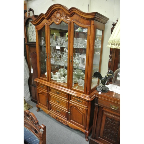 415 - A stunning antique style display cabinet with carved design on cabriole legs.