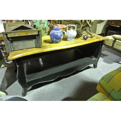 973 - A large wooden coffee table with painted base.