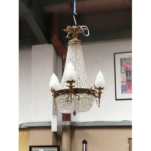 993 - An antique/ Empire style chandelier/ light fitting.