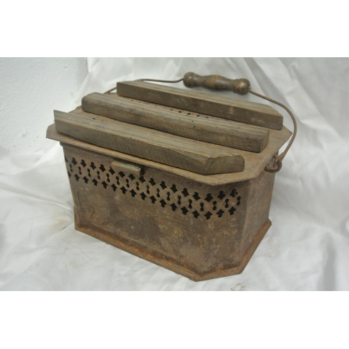 13 - A decorative antique carriage foot warmer.