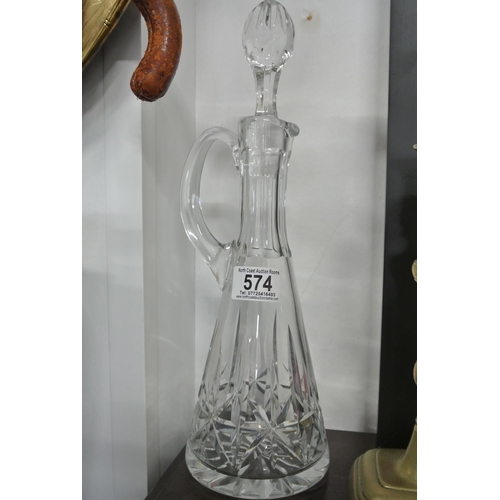 574 - A Crystal Claret jug with stopper.