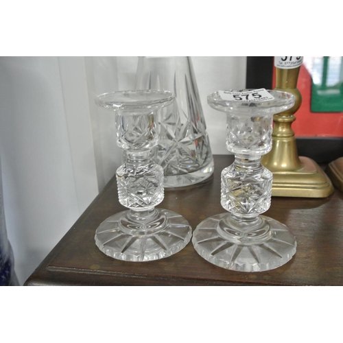 575 - A pair of crystal candlesticks.