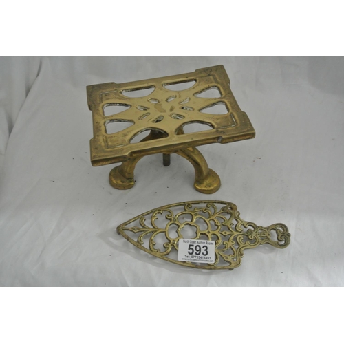 593 - 2 antique brass trivets.