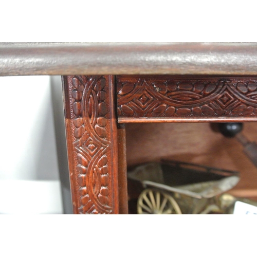 597 - A stunning antique handmade bookcase with carved design.