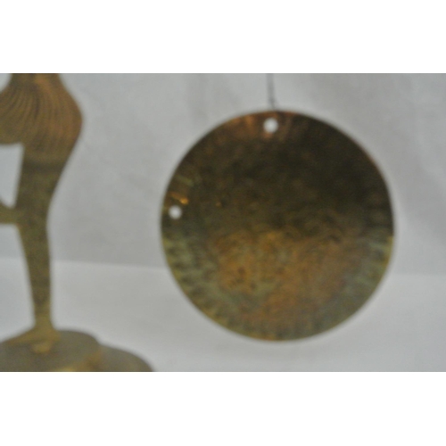 619 - A vintage handmade brass gong, in the form of an Art Deco style lady.