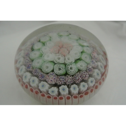 621 - A collection of 4 decorative glass paperweights.